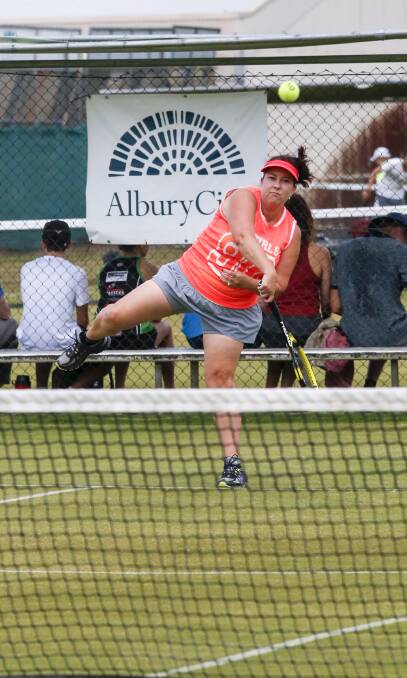 BIG SERVE: Thurgoona's Jo Hughes puts everything into her swing during her section one pennant match at Albury on Saturday. Picture: SIMON BAYLISS