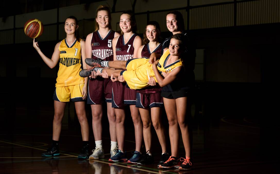 SUPER SIX: Wodonga's Izzy Delcour, Steph Gorman, Marney Gorman, Casey Arden and Breanna Green holding Wil Conway. Picture: SIMON BAYLISS