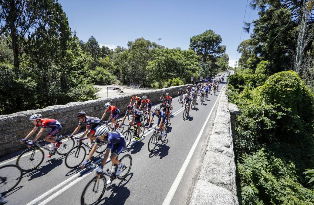 ICONIC: Orica Scott riders lead the peloton, which featured Albury's Jesse Featonby and his Drapac teammates, across the bridge into Yackandandah. Pictures: JAMES WILTSHIRE
