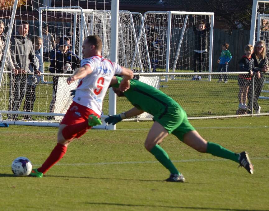 SO CLOSE: Chad Bugeja fires off a shot at goal for Murray United. 
