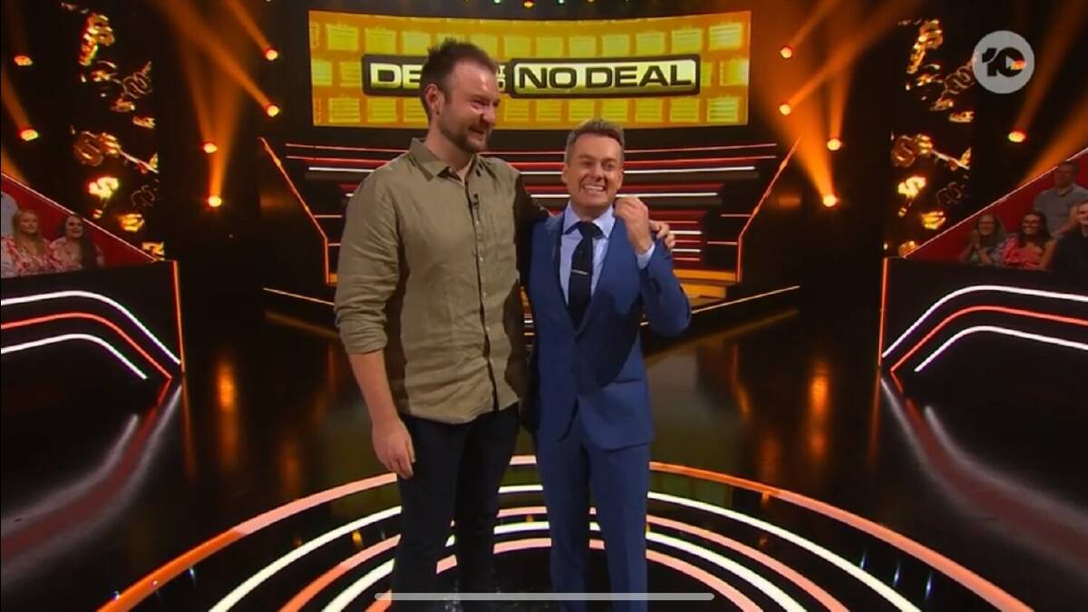Wodonga's Nick Steain with host Grant Denyer after being called up to the podium on Deal or No Deal on Thursday, March 21. Picture by Network 10