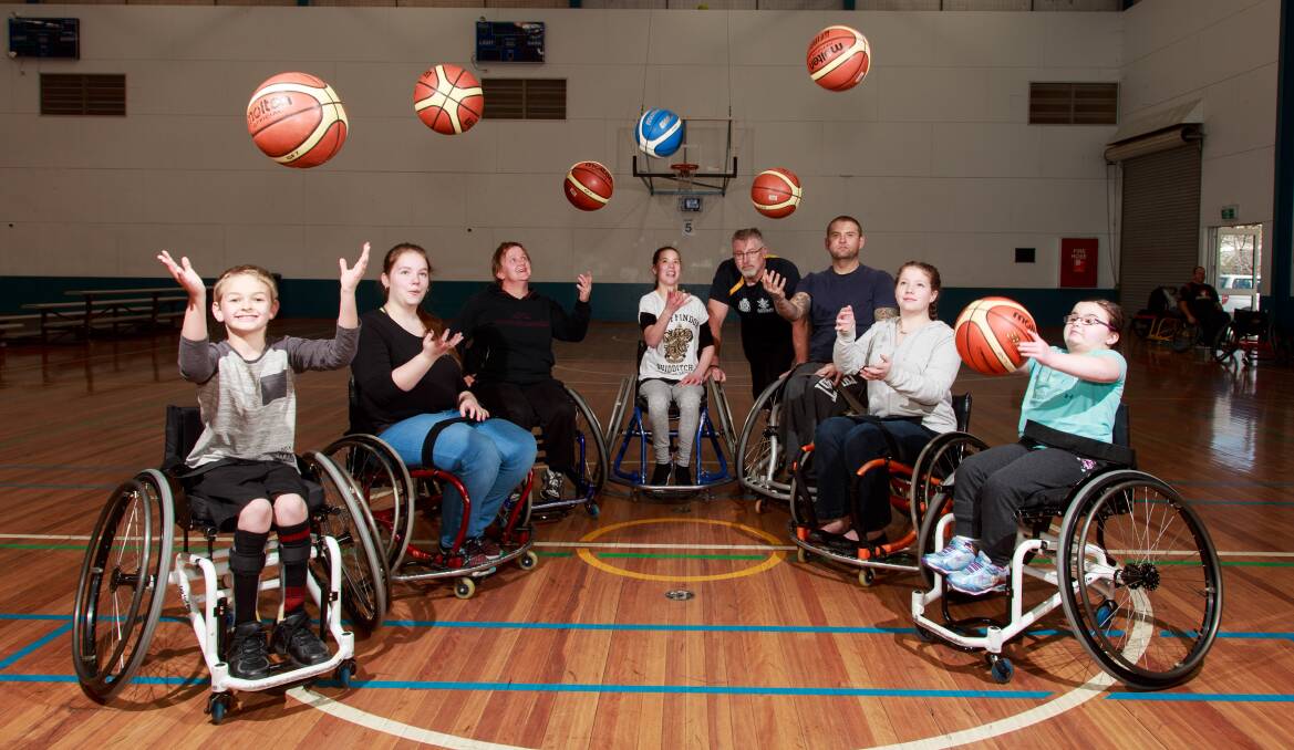 ALL SET: Wheelchair basketballers Jackson Gray, Mackayla McMahon, Nat Dyball, Felicity Tomkins, Dennis Ramsay (coach), Michael Gray, Catie McMahon, Lil Dyball before the NSW Country Cup this weekend. Picture: SIMON BAYLISS