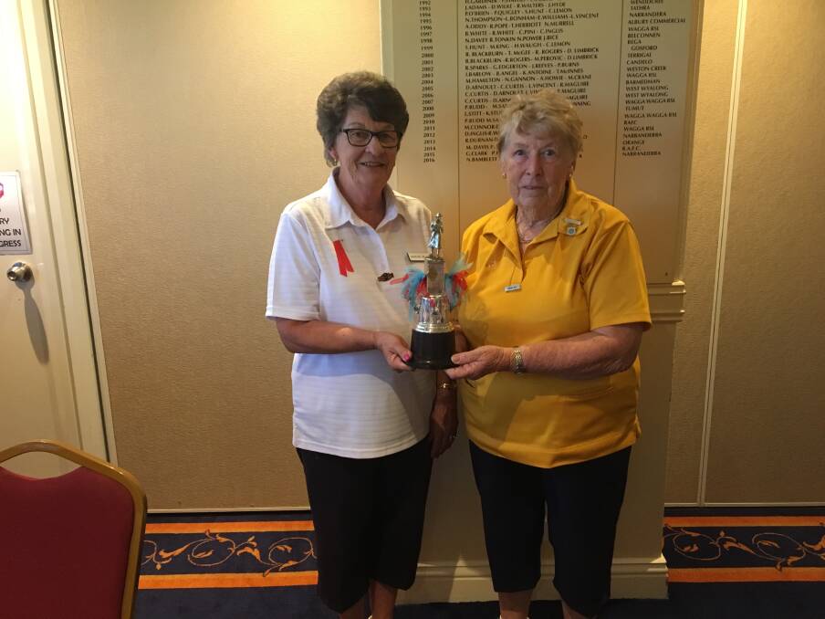 Former Central Riverina Women's Bowling Association president Marilyn Hillier and Sandra Kitt with the Ruth Reiher Trophy, which was contested by the Central Riverina and Riverina districts for many years. Picture supplied
