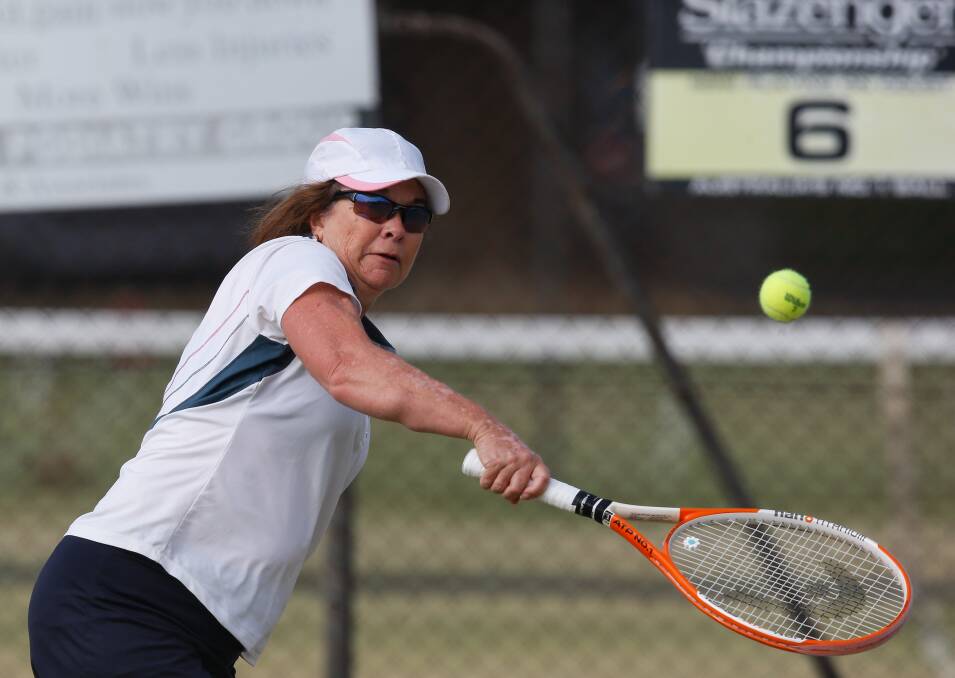 EYE ON THE BALL: Juleen Cannon in action during the Tuesday ladies pennant season at the Albury grass courts. She has been in strong form throughout. Picture: MARK JESSER