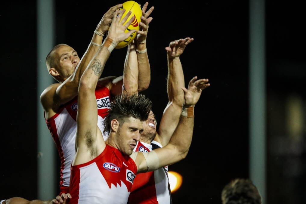 HIGH FLYER: Sam Reid crashes the pack to take an excellent contested mark during the 
Swans' thrilling victory against St Kilda at Lavington Sports Ground on Sunday night. 
Picture: JAMES WILTSHIRE