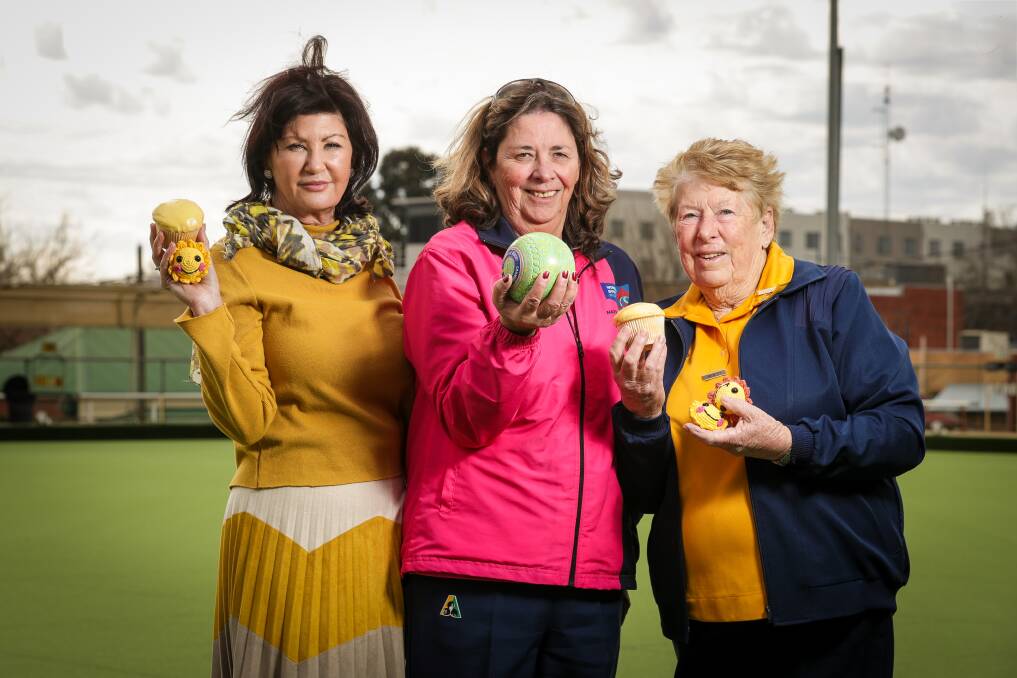 Albury Wodonga Regional Cancer Trust Fund board member Colleen Gorman and Riverina District Women's Bowling Association's Sue Thurley with Sandra Kitt ahead of the Sunshine Week fundraiser in 2018. Picture by James Wiltshire