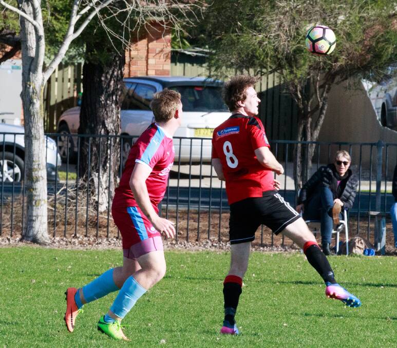 STRONG HEADER: Wangaratta defender Joel van der Leeuw clears the ball during the Devils' frustrating 1-1 draw with Twin City last weekend. Picture: SIMON BAYLISS