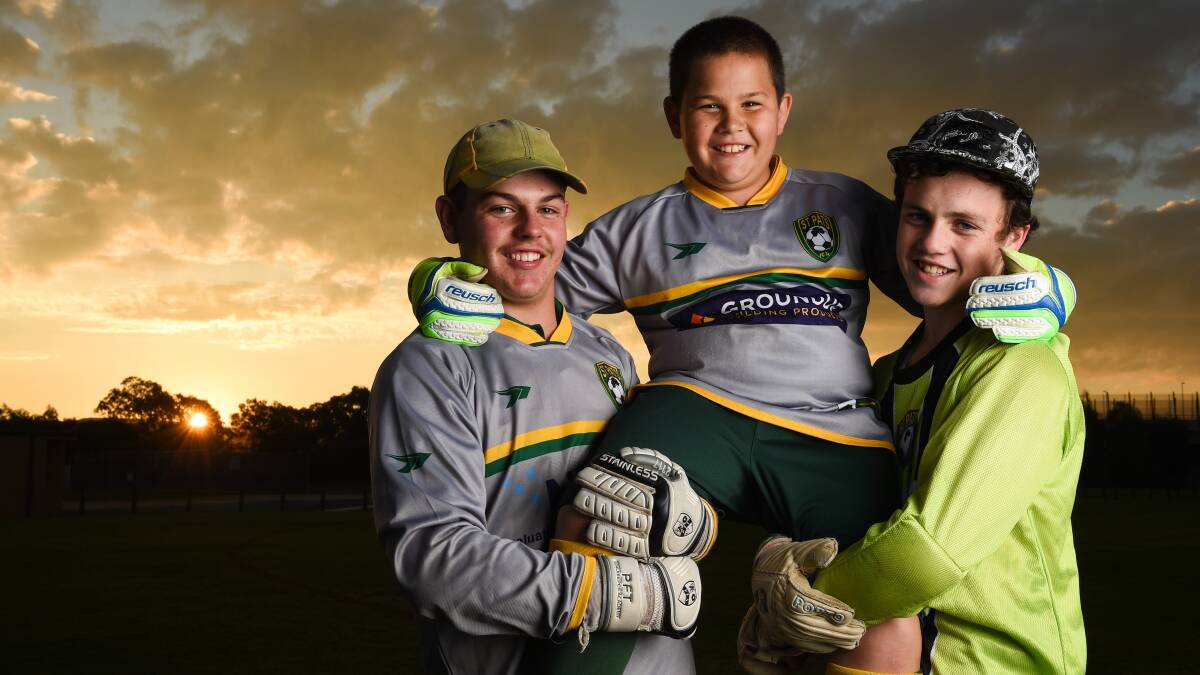 FAMILY PRIDE: Matthew (15), David (9) and Joshua (14) Green are the goalkeepers for all but one of St Pats' junior soccer teams. Picture: MARK JESSER