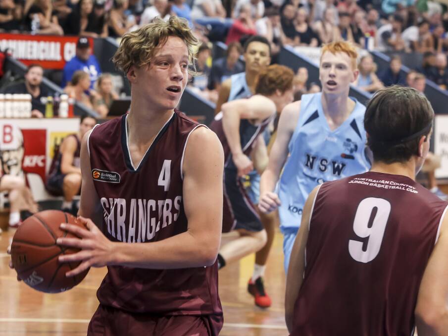 BIG BUSHRANGER: Broden Collins searches for an outlet during the under 18 boys' gold medal match at the Australian Country Junior Basketball Cup.