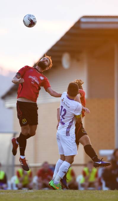 FLYING HIGH: Zac Walker locks in on a header during Murray United's tough clash with Springvale White Eagles in Wodonga last weekend. Picture: MARK JESSER