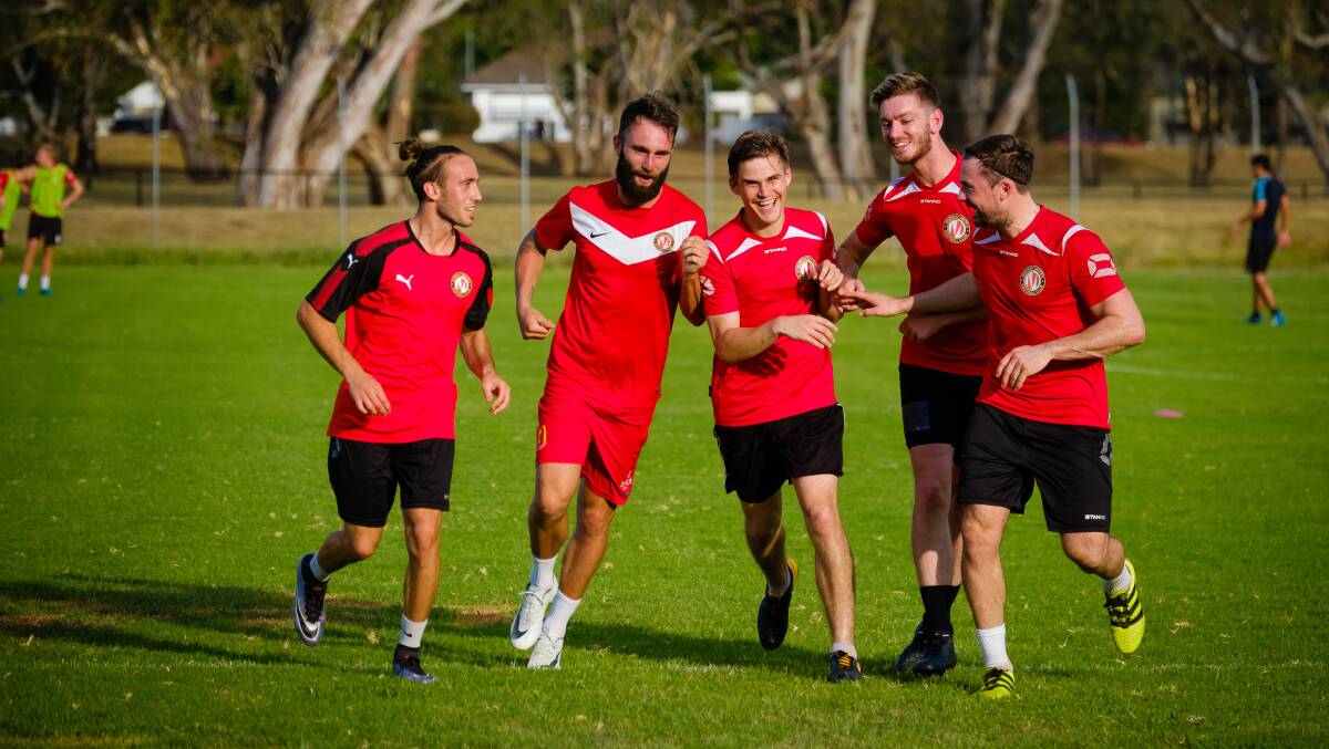 BIG SIGNING: Former St Pats and Albury United striker Ryan Luty (middle) is welcomed to Murray United by teammates Gonzalo Freddi, Zac Walker, Alex West and Ashley Dunn at training this week. Picture: SIMON DALLINGER