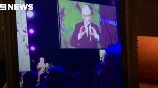 Malcolm Turnbull mimics the US President at the Midwinter Ball in Canberra. Photo: 9news.com.au