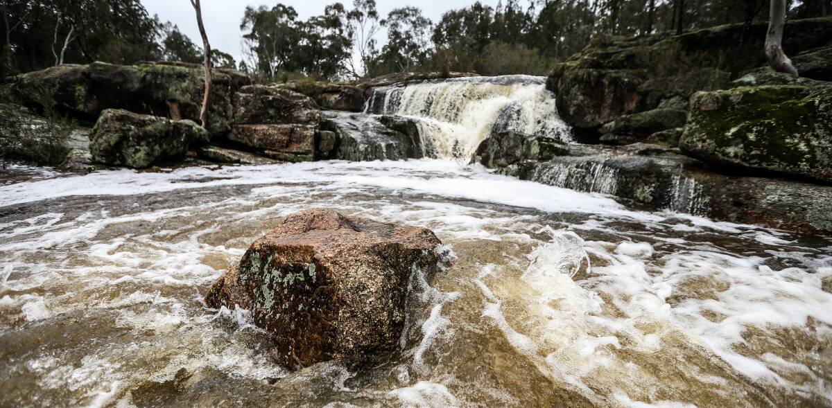 GO WITH THE FLOW: It was worth the trip to the always picturesque Woolshed Falls near Beechworth to see the water flow on the weekend. Pictures: JAMES WILTSHIRE