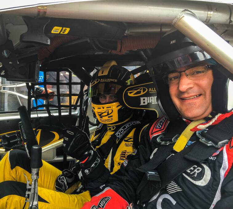 STRAP YOURSELF IN: Andrew Jones in the driver's seat prepared to take lifelong motorsport fan Tim Farrah on the ride of his life at Sandown. Tim has been a motorsport fan for 45 years but it was his first 'hot lap' experience.
