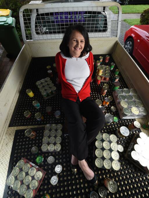 IN THE CAN: Christine Calnin of Wodonga is collecting canned goods for Border organisations that support people in need. Picture: MARK JESSER