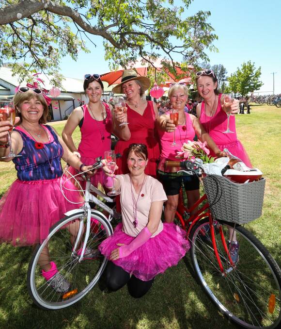 PERFECTLY PINK: Angela Elvidge, front, and, back from left, Kelly Johnson, Fiona Lawrence, Lindy Dupille and Janet Zouzel at the fifth annual Pink Pedal Party on Friday. Picture: JAMES WILTSHIRE