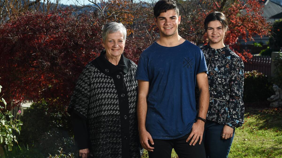 SUPPORT: Ebony Moran (below far right) with her grandma Christine Clancy and brother Jaara Moran. Ebony hopes a degree in speech pathology will allow her to help Aboriginal people in remote areas.