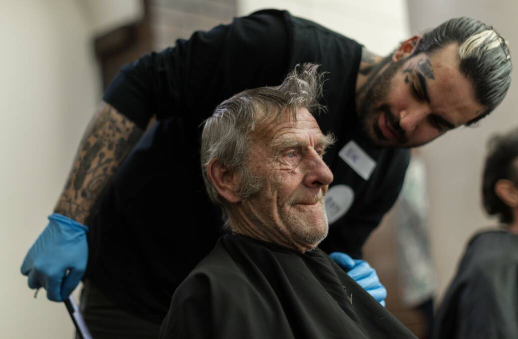 BE KIND: Nasir Sobhani gives haircuts to homeless people. The Red Cross wants us all to be a little more like the Streets' Barber this Christmas, and be kind to each other.