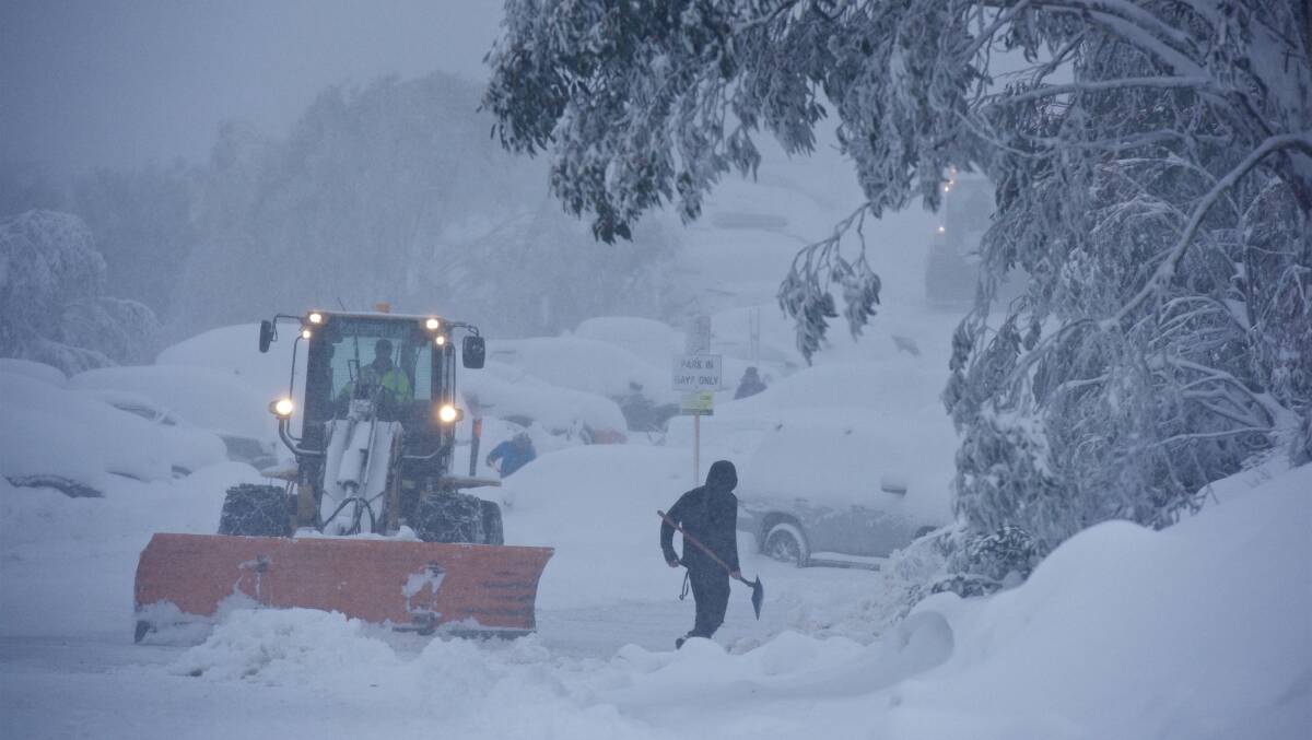 Crews at Falls Creek after heavy snow fell on Sunday. Photo: Chris Hocking