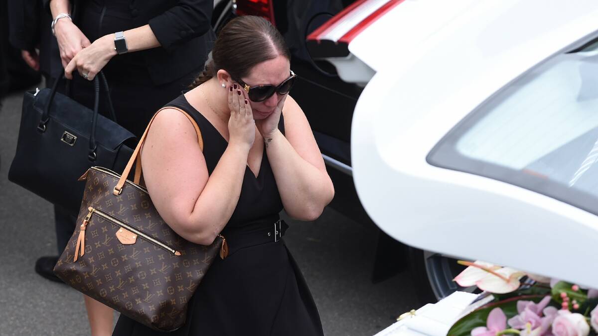 The agony: A mourner at the funeral of Annabelle Falkholt and parents Lars and Vivian. A reader says judges need to toughen up on serious driving offenders. 