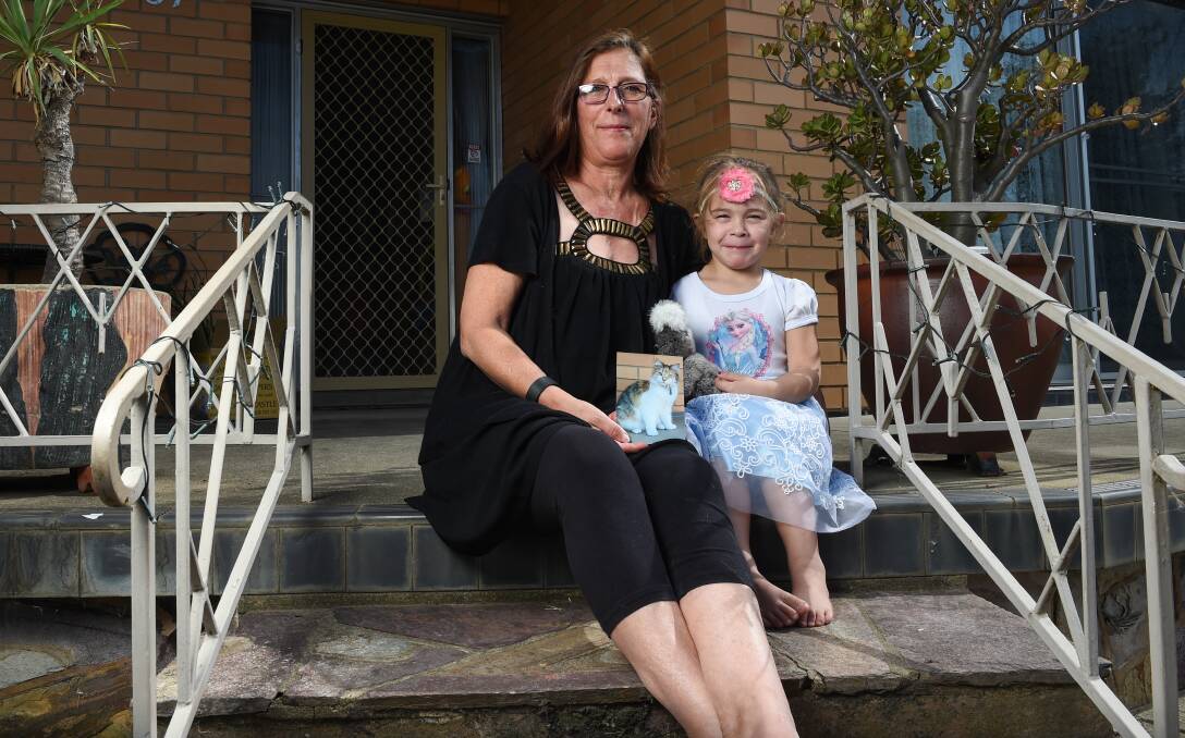 SIGN-UP: Bronnie Lehmann, with grandaughter Azaiah, 4, has started a petition to take to Wodonga council about missing cats. Picture: MARK JESSER