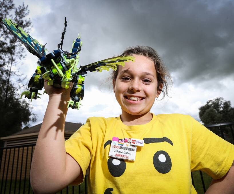 TALENTED: Celeste Dakos, 8, shows off Morro, a Ninjago dragon she built with her father, Grant, vice president of the Albury Wodonga Lego Users Group. She has been collecting Lego for two years. Pictures: JAMES WILTSHIRE
