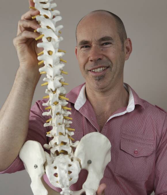 KEY TO HEALTH: Wodonga chiropractor Saxon Selvey is asking Border residents to be mindful of their posture to coincide with World Spine Day. One in six Australians have a chronic back problem. Picture: ELENOR TEDENBORG