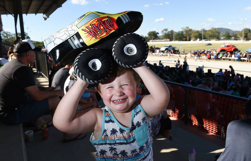 BIGGEST FAN: Mason Smith-Moore, 2, of Wodonga, who is a big-truck fan, gets in on the action at the Monster Trucks show at the Albury Showgrounds on Saturday night. Pictures: MARK JESSER