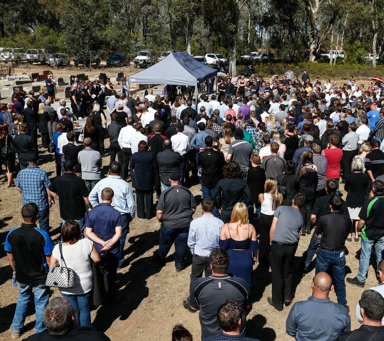 DEVASTATED: More than 500 people, some coming from as far as Wollongong, gathered to pay tribute to Wayne Martin. 