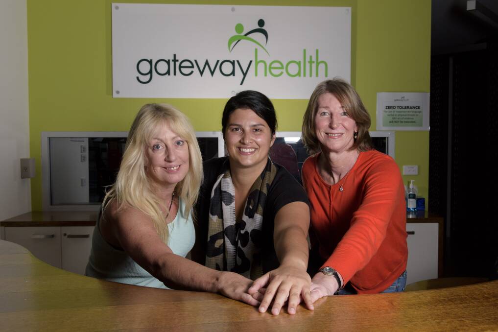 IN IT TOGETHER: Gateway Health WayOut Wodonga project worker Sarah Roberts (middle) works with a community reference group to guide Australia's first regional gender services clinic, including Kerry-Lee Power and Rachel Richardson, to hep inform the registered nurse and team at the service.