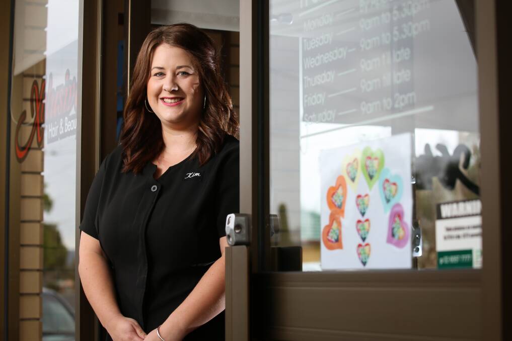 YES: Kim Allan, manager of Xclusive Hair and Beauty in Wodonga, chose to put up 'vote yes' stickers in support of her LGBTQI customers. Picture: JAMES WILTSHIRE