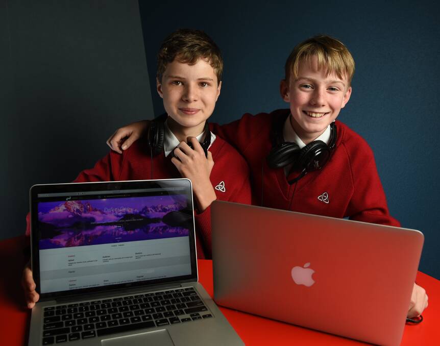 TECH-SAVVY: Trinity Anglican College's Finlay Campbell and Thomas Summerfield, both 13, run a music-sharing website. Picture: MARK JESSER