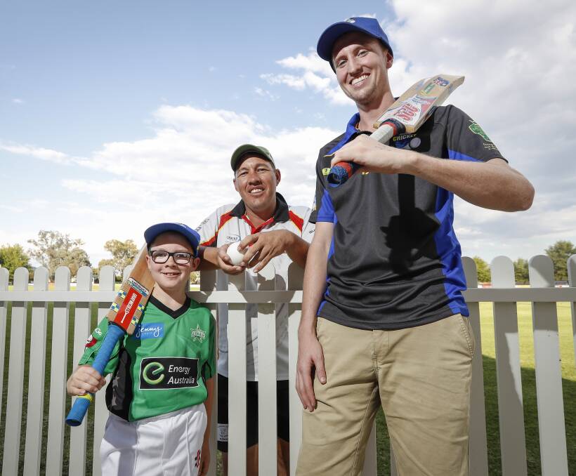STARTING YOUNG: Toby Hartshorn, 8, has made dad Chris proud making his debut in blind cricket with Australian representative Mike Hamilton, who has the same condition affecting sight as Toby. Picture: JAMES WILTSHIRE