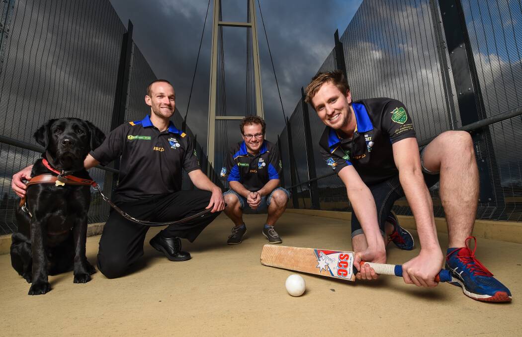 WELCOME: Daniel Searle (with Frodo), Matt Kent and Mike Hamilton are inviting people to a Blind Cricket come and try day. Picture: MARK JESSER