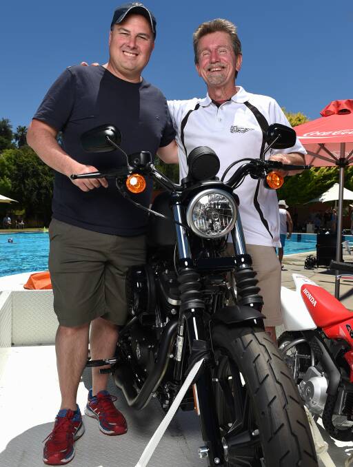IMPORTANT CAUSE: Adam Joss is part of the community trust fund committee raffling off a Harley Davidson to support Sam Baker, the son of Wayne. Picture: MARK JESSER