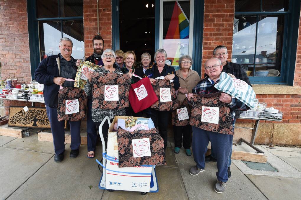 GROUP EFFORT: Volunteers gather in Beechworth to hand out the first 1900 boomerang bags they have created since January. Picture: MARK JESSER