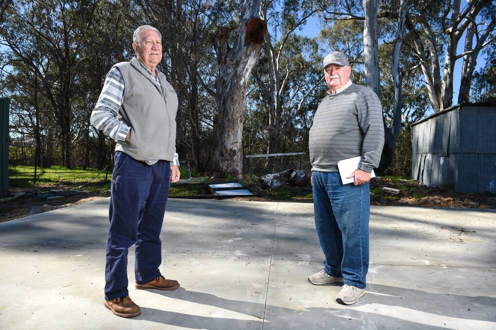 Wahgunyah Men's Shed members Alan Pleitner and Len Carlson are still pushing to have fees to remove an old tree on their site waived. Picture: MARK JESSER