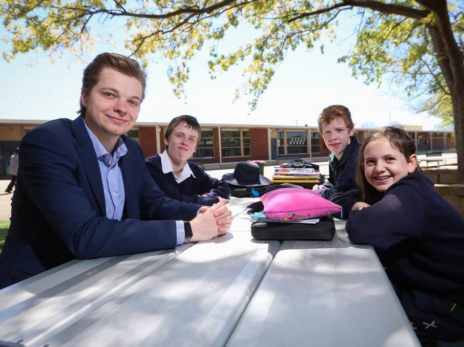 FRIENDS: Thomas Kuzma with Aspect Riverina School students Bryce Ackerly, Adam Lippiatt, and Summer Halford, all 13. Picture: JAMES WILTSHIRE