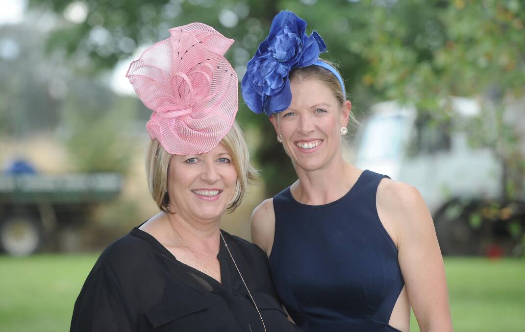 HATS OFF: Fashions on the Field best hat winner Megan Joyce and runner-up Bec Cardile, both from Holbrook.