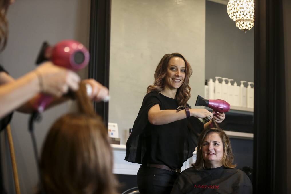 SOARING: Ms Wilde, with client Michelle Howard, is also in the running to be NSW/ACT Hairdresser of the Year and wants to use the title for the White Ribbon cause.