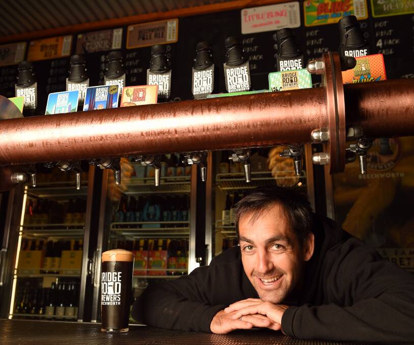 WINNING BEER: Bridge Road Brewers owner Ben Kraus shows off the Robust Porter, which won best beer at the Sydney Royal Beer and Cider Show. Picture: MARK JESSER