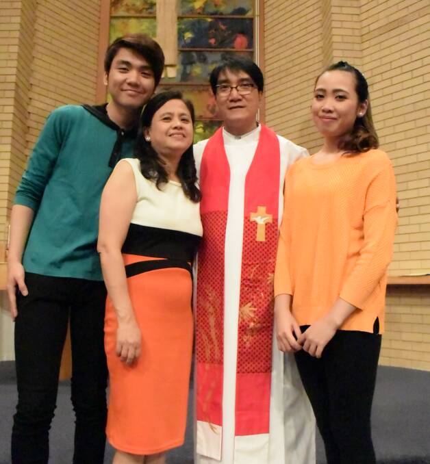 FEELING AT HOME: Berlin Guerrero celebrates his induction as a minister at the Emmanuel Uniting and Anglican Church Wodonga with his family.