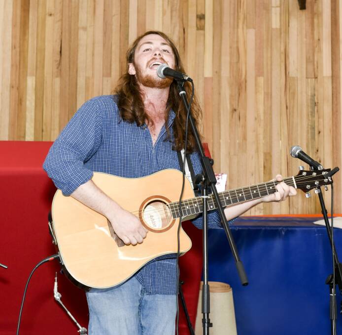 BIG BREAK: Wodonga singer-songwriter Darcy Johan wins the Yackoustica Battle at The Shed, landing him a spot in the 2018 Yackandandah Folk Festival line-up. Pictures: SIMON BAYLISS
