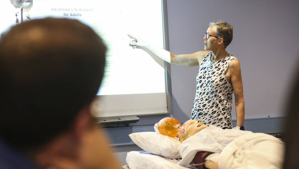 Barbara Robertson, director of anaesthetics at AWH, takes students through basic life support.