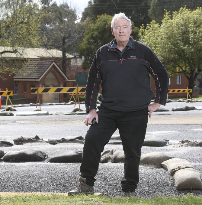 NEED FOR CHANGE: Historian Ray Crispin says the trial intersection on Towong Street in Tallangatta is causing people to bypass the town, as access is restricted to the service station. Picture: ELENOR TEDENBORG