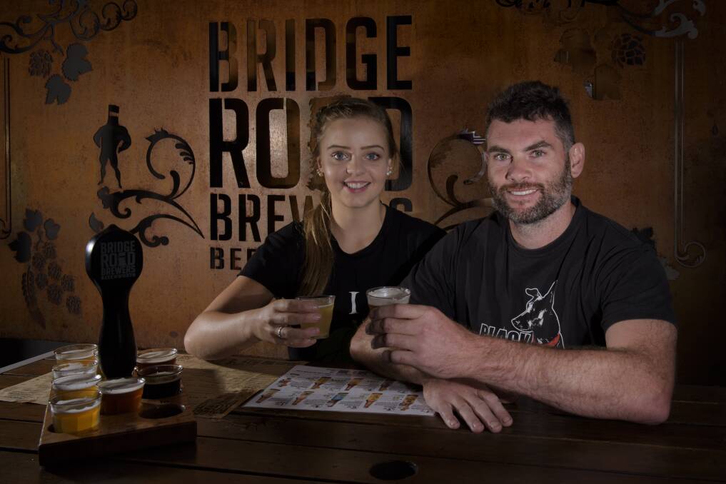 Maxine Cappelli from Bridge Road Brewers and Black Dog Brewery founder James Booth toast to the High Country Hops festival. Picture: SIMON BAYLISS