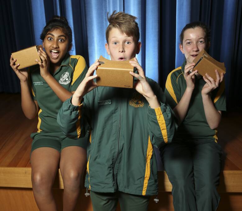 IMMERSED: St Anne's Primary School students Shreya Shetty, 12, Harris Arcus, 11, and Lily Lasd, 12, look at the habitat of the whale shark in Google's virtual reality technology as part of a roadshow. Picture: ELENOR TEDENBORG