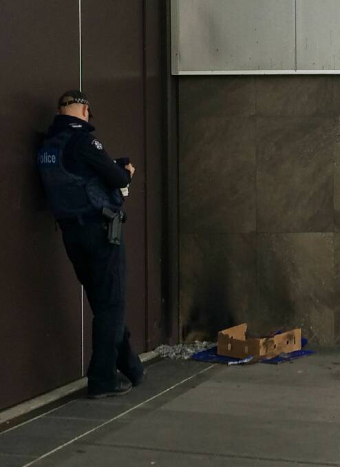 Wodonga Police investigate a fire at The Cube Courtyard on Monday.