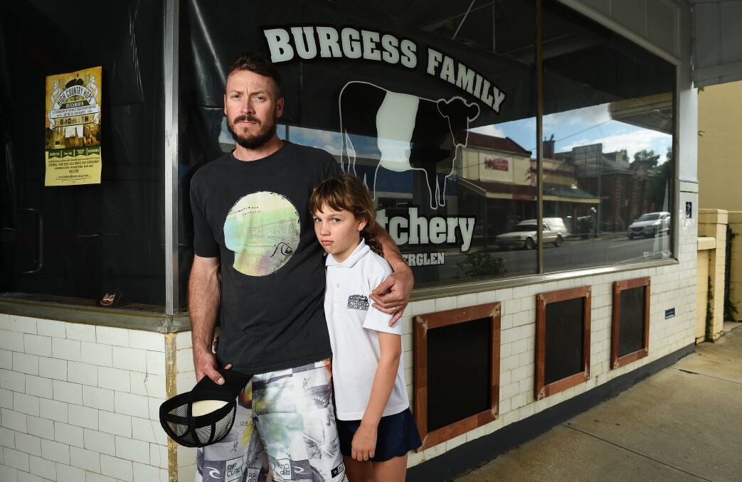 SHUT: Mark Burgess, with Ruby, 10, says he had no choice but to close his family butchery in Rutherglen's main street. Picture: MARK JESSER