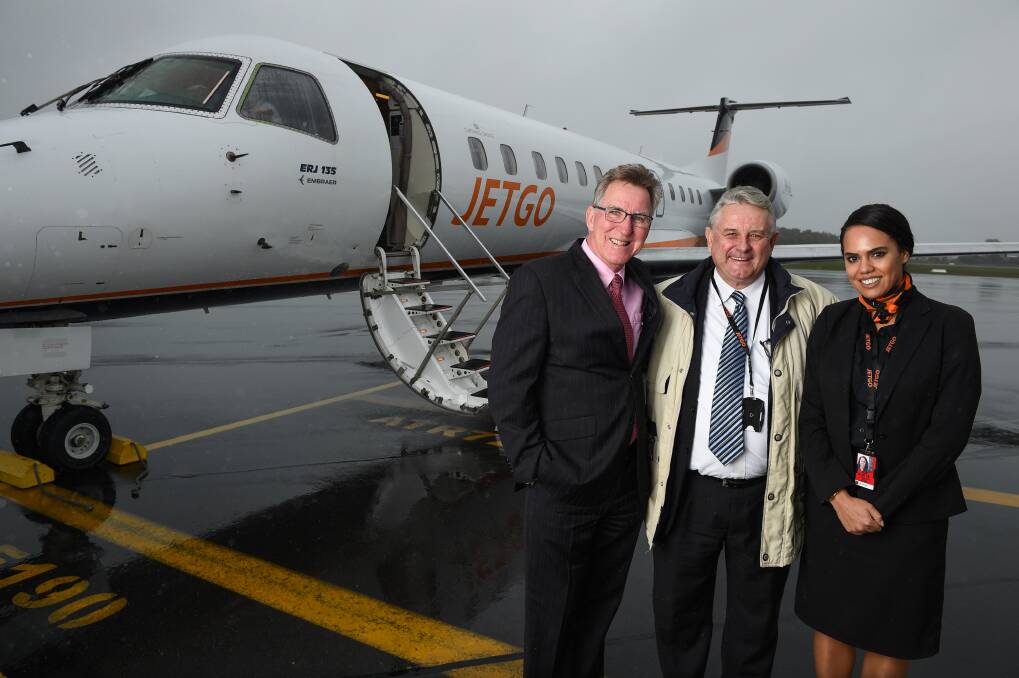 SOARING: JETGO managing director Paul Bredereck greets Albury Mayor Kevin Mack with flight crew member Katherine Ryall to announce Saturday flights from Albury to Brisbane, now a daily service. Picture: MARK JESSER